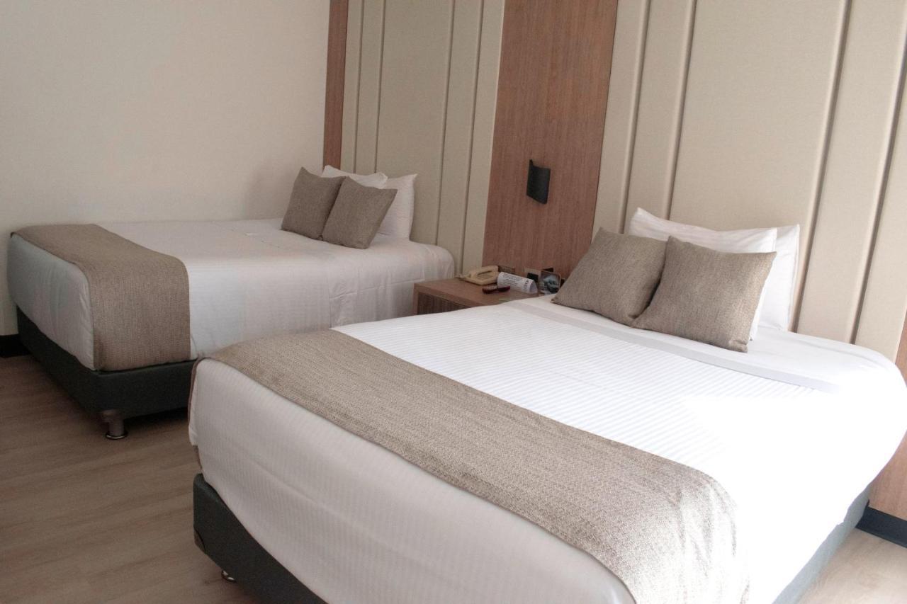 Hotel Dann Carlton Belfort Medellín Exteriör bild A room at the hotel